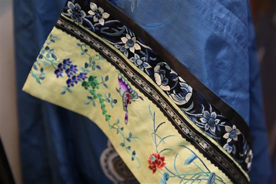 A Chinese blue silk, damask and embroidered ladys robe, late 19th / early 20th century,